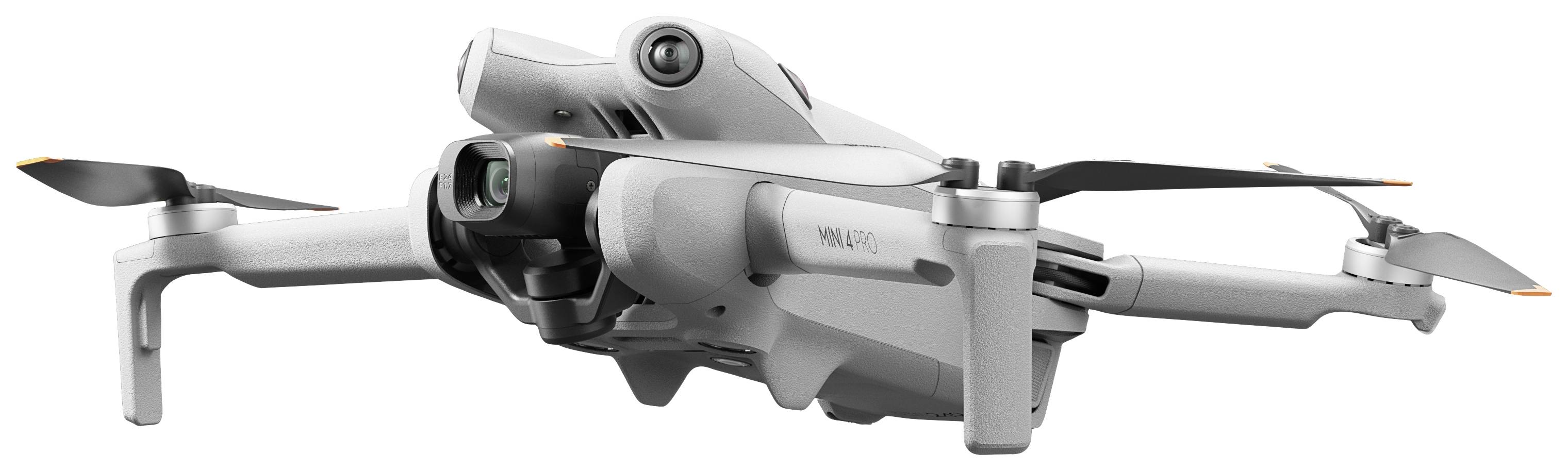 Un drone blanc à quatre rotors, légèrement incliné, représenté en mode de vol.