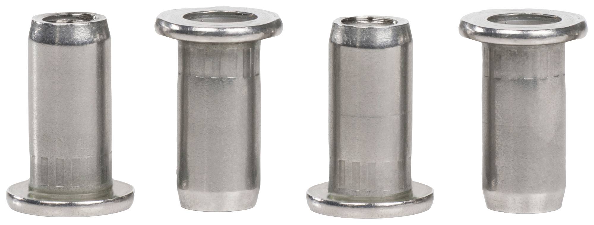Quatre insertions métalliques avec bord plat et centre creux, placées côte à côte. Elles sont cylindriques et de couleur argent.
