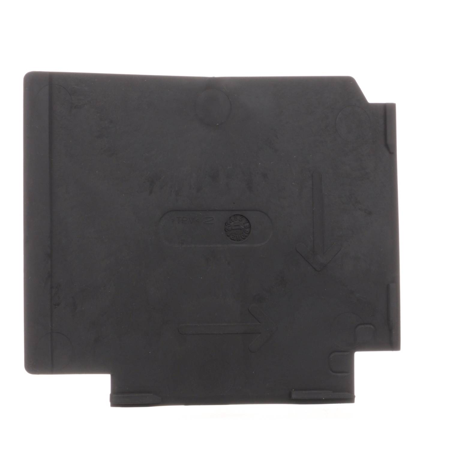 Pièce rectangulaire en plastique noir portant des empreintes de flèches et une petite marque ronde au centre.