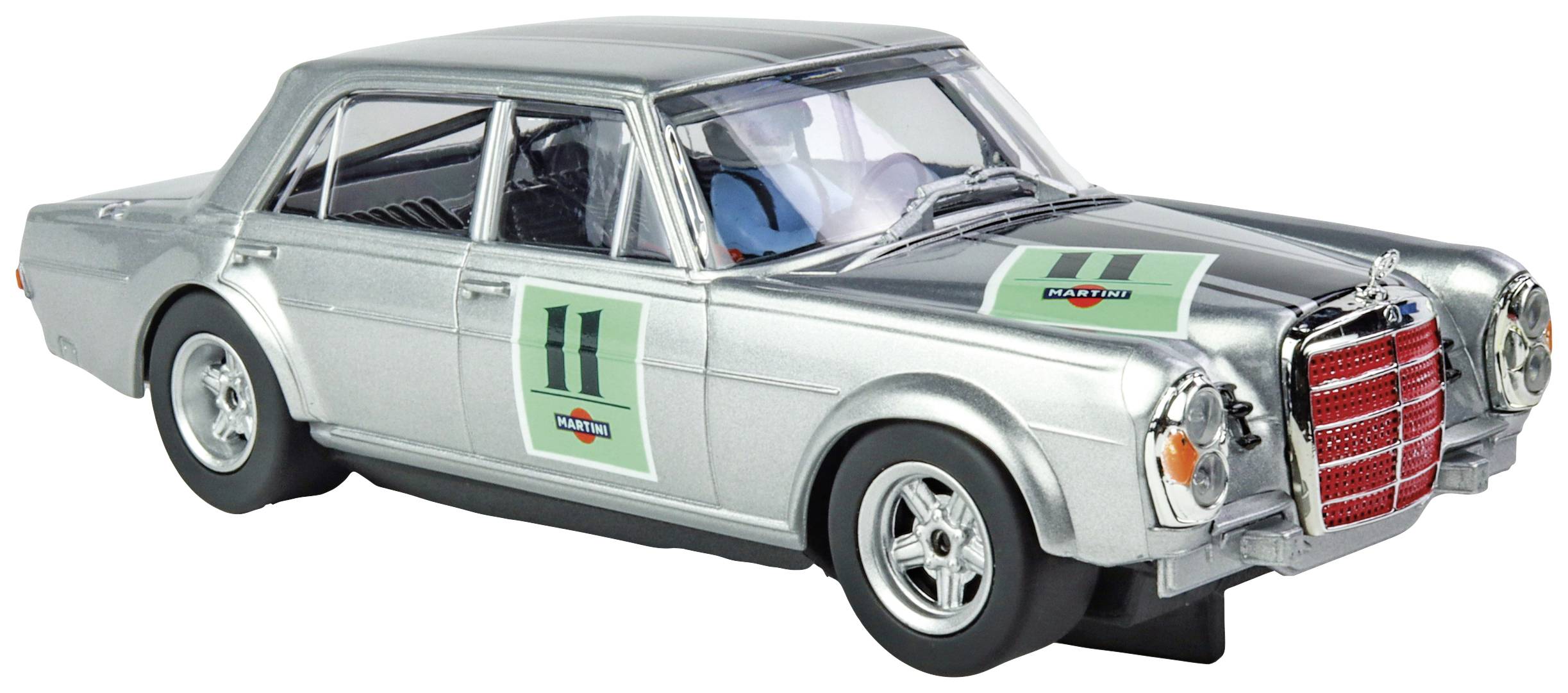 Une voiture miniature argentée avec des autocollants de course et le numéro '11' sur le côté. La voiture présente les caractéristiques classiques d'un modèle plus ancien.