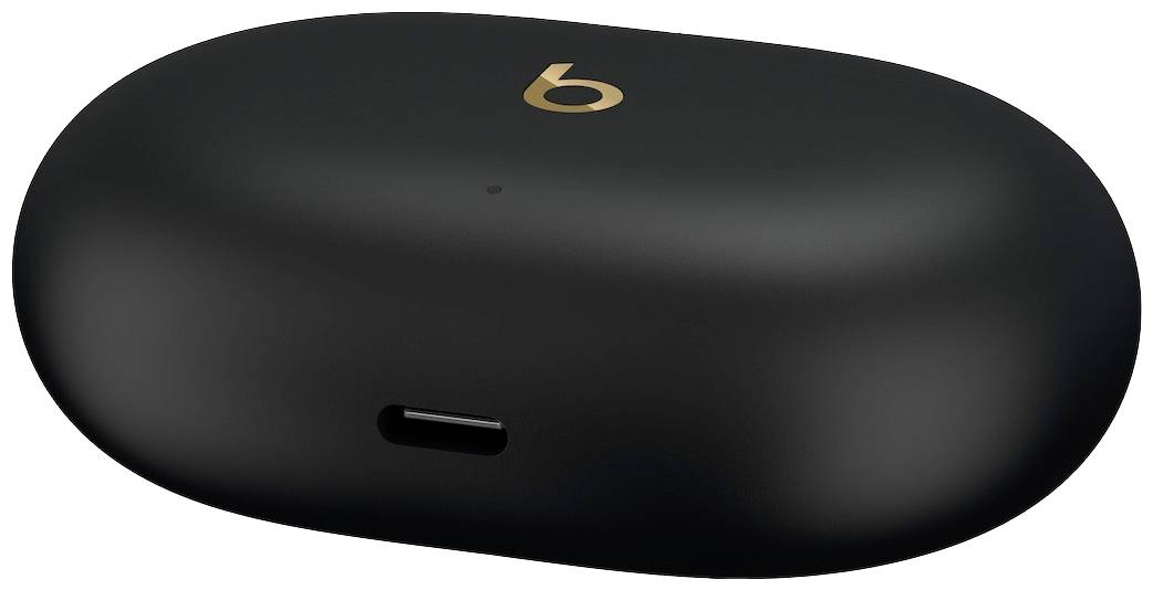 Étui de charge sans fil noir avec logo 'b' doré sur le dessus, principalement destiné aux écouteurs.