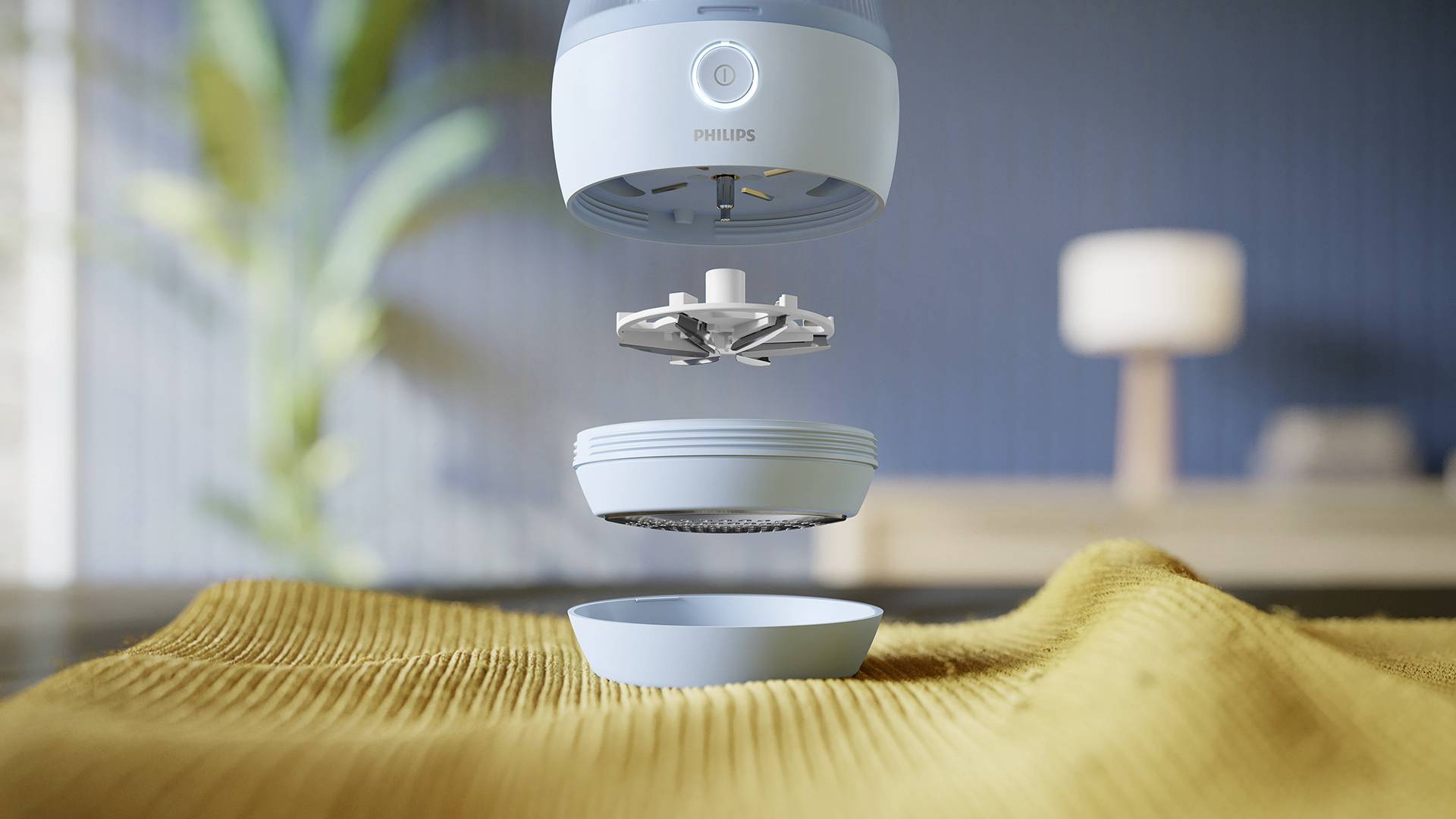 Un purificateur d'air bleu est représenté au-dessus d'une couverture jaune. Les différentes pièces sont démontées et flottent dans les airs.