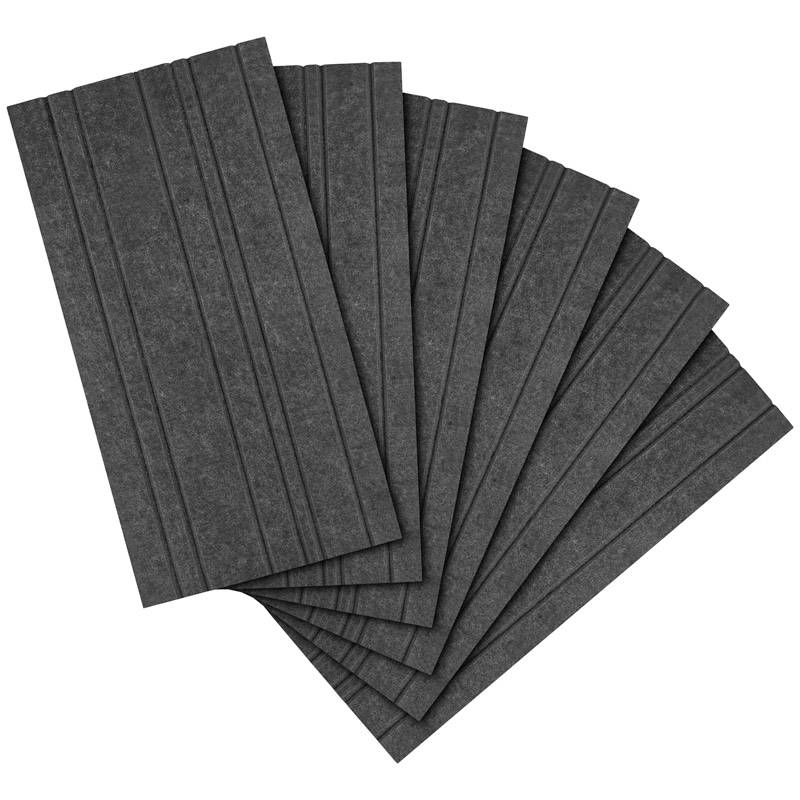 Plusieurs tapis en caoutchouc rectangulaires de couleur gris foncé sont disposés en éventail. Ils présentent des rainures parallèles et servent à l'isolation acoustique.