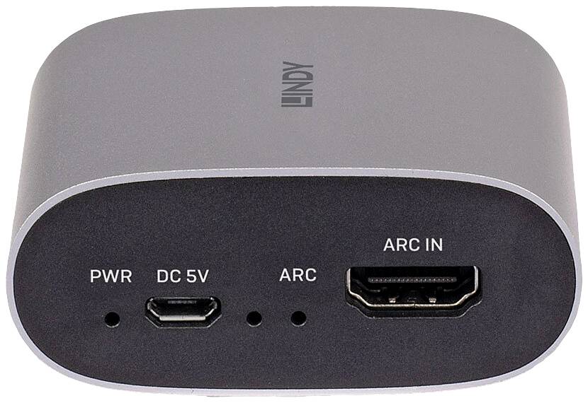 Petit appareil électronique gris avec des ports HDMI et micro-USB, étiqueté 'PWR', 'DC 5V' et 'ARC IN'.