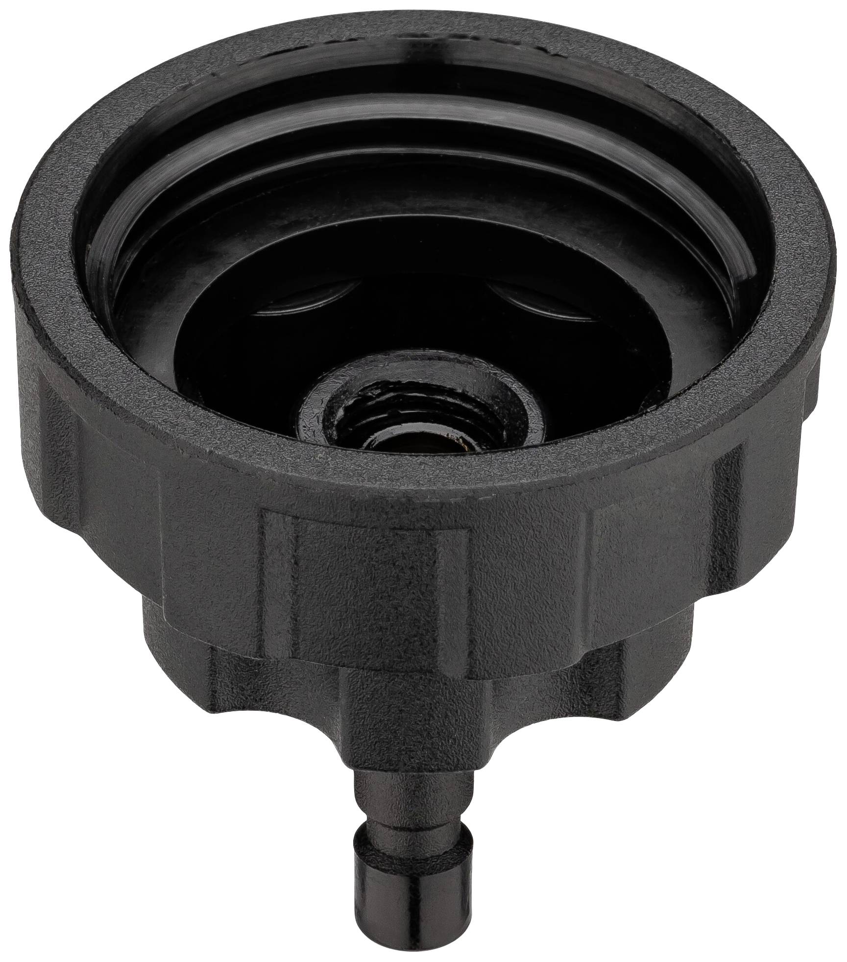 Un accessoire en plastique noir avec un bord strié et une ouverture centrale. Utilisé pour la connexion dans un système hydraulique.