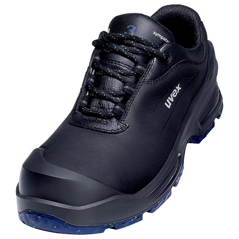 Chaussure de travail noire, robuste, avec bout renforcé et semelle à faible profil. Nom de marque 'uvex' imprimé sur le côté.