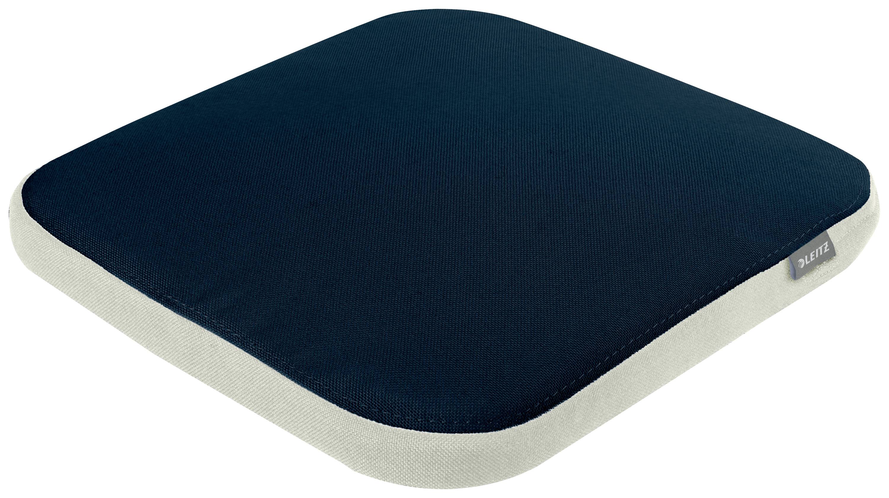 Coussin carré bleu marine avec bordure blanche, adapté pour s'asseoir.