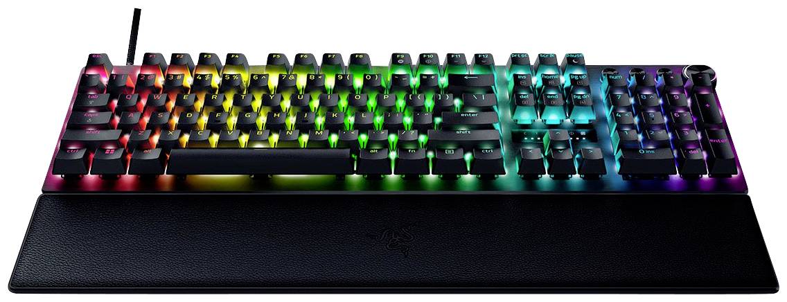 Clavier mécanique avec éclairage RVB et repose-poignets amovible. Des effets de couleur aux teintes arc-en-ciel sont visibles.