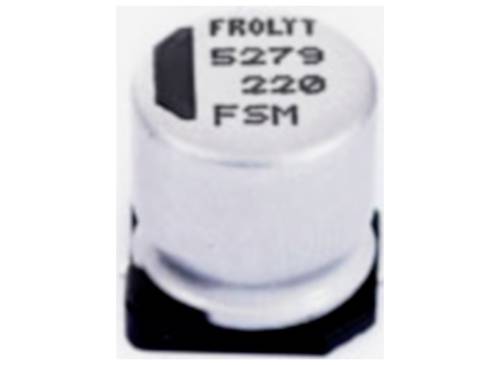 Ein zylindrischer Elektrolytkondensator, silbern mit schwarzer Markierung, trägt die Aufschrift 'Frolyt 5279 220 FSM'.