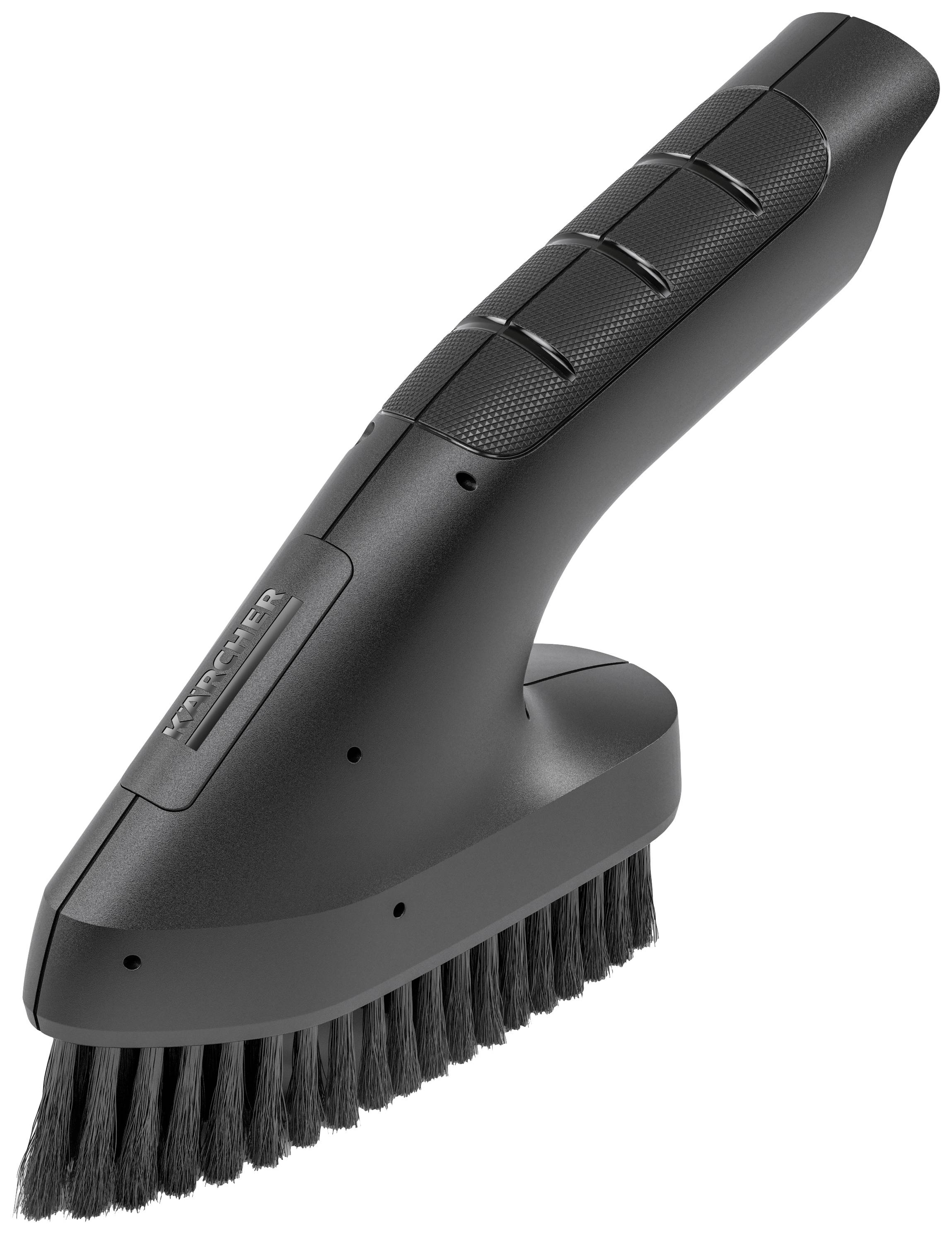 Un embout de brosse à main noir avec des poils, adapté à un aspirateur pour le nettoyage des surfaces et des tissus d'ameublement.