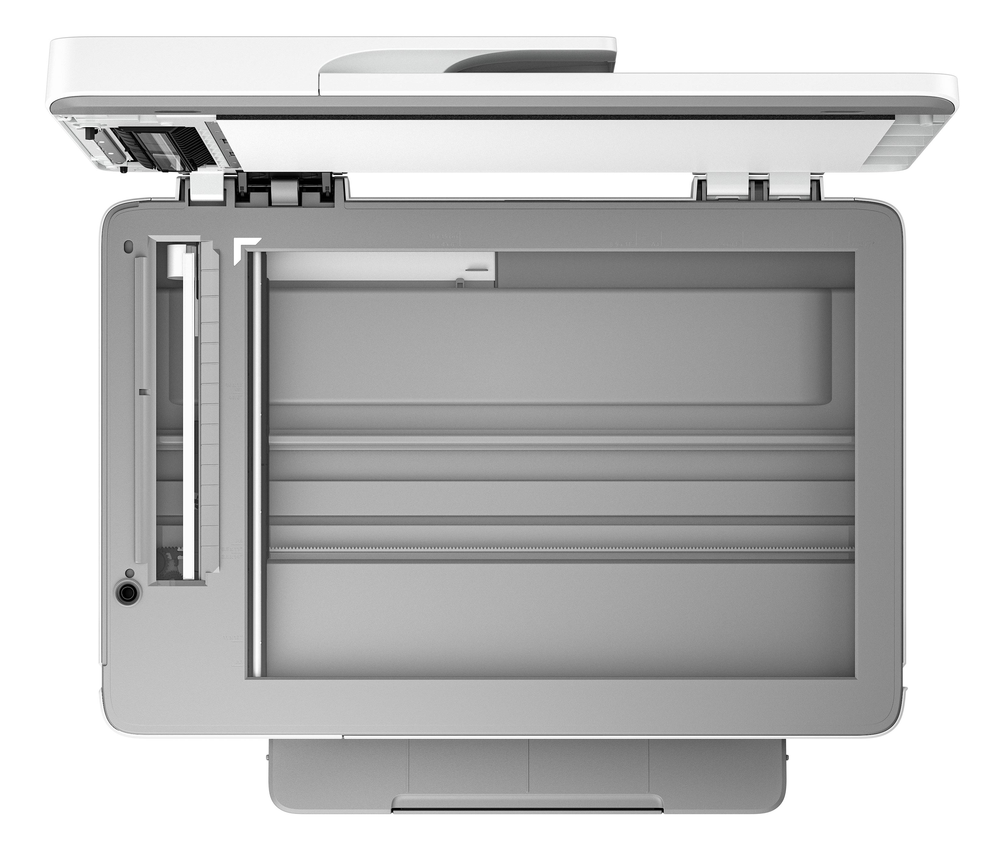 Un scanner à plat ouvert, vu de dessus. La surface de numérisation et le couvercle sont visibles.