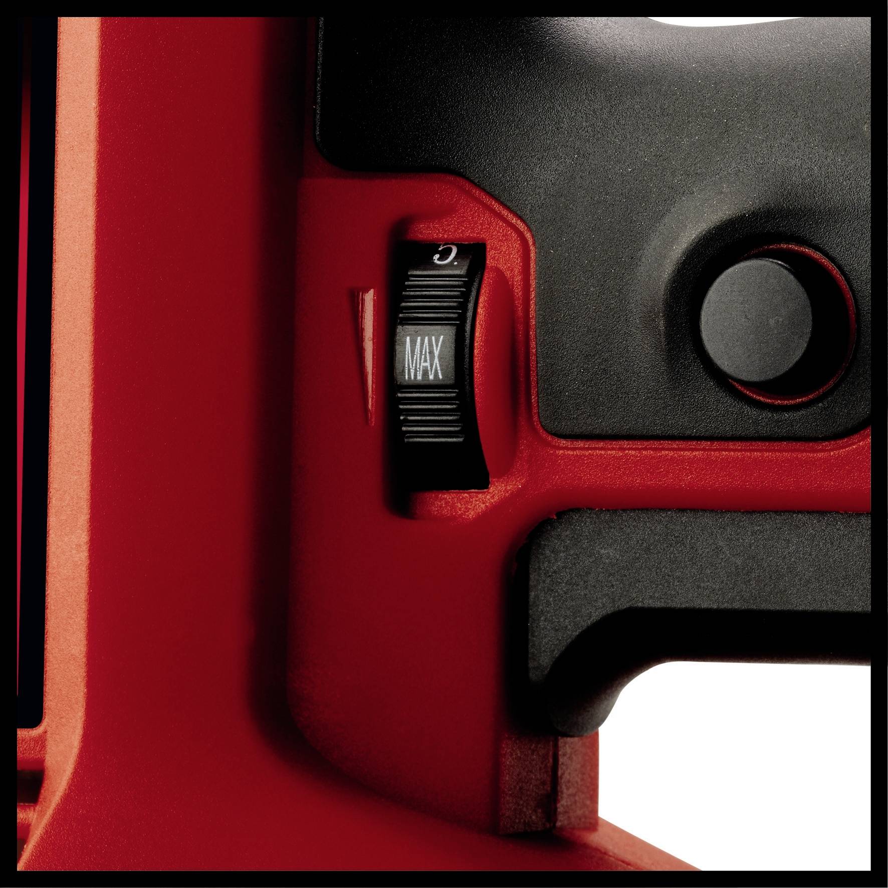 Gros plan d'un appareil rouge avec un bouton tournant réglé sur 'MAX', et un bouton noir à côté.