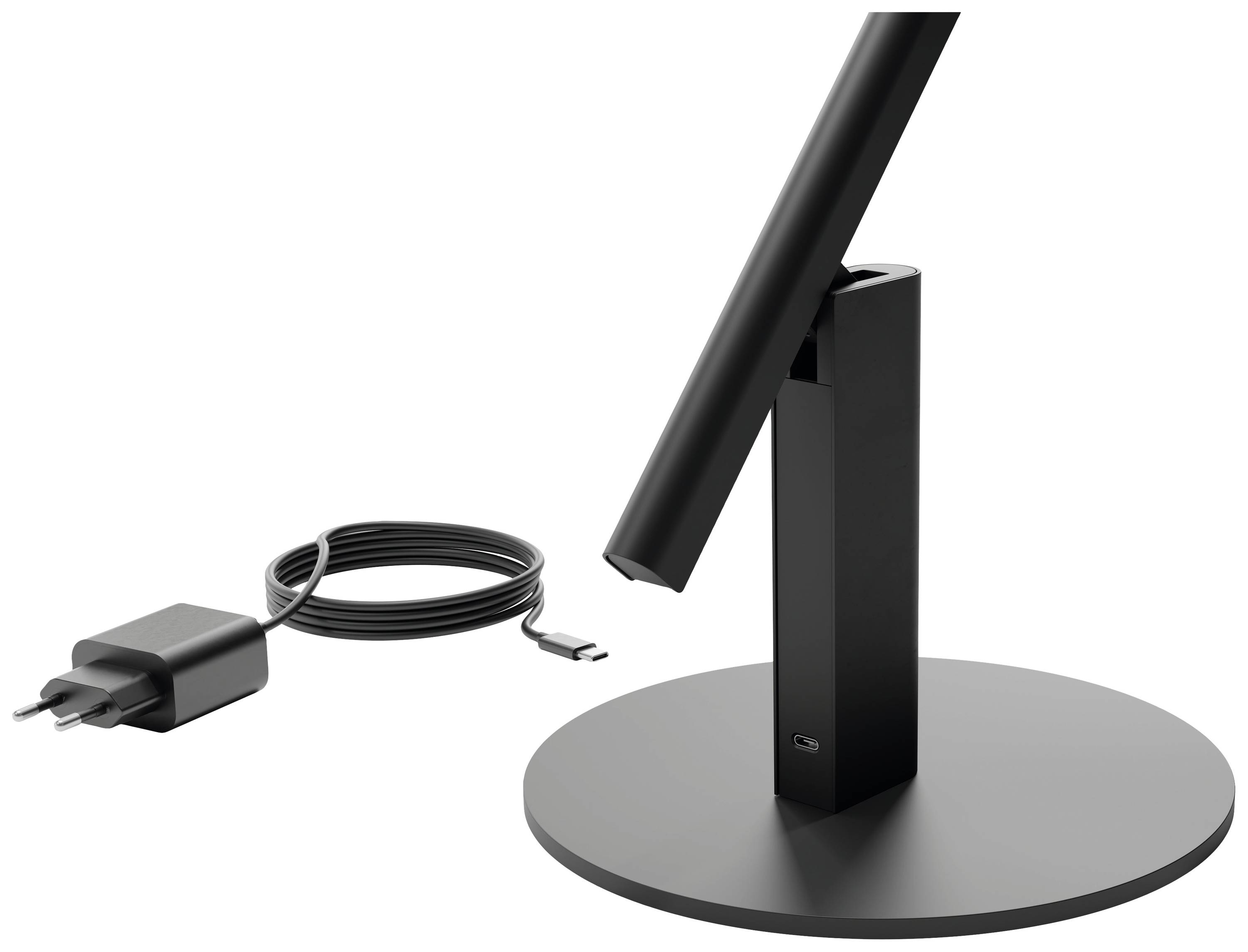 Support de lampe de table noir à base cylindrique, à côté d'un câble de chargement USB noir avec adaptateur.