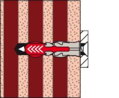 Le diagramme montre un bâton de dynamite dans le sol, prêt à déclencher une explosion. Les marques indiquent la direction de la déflagration.