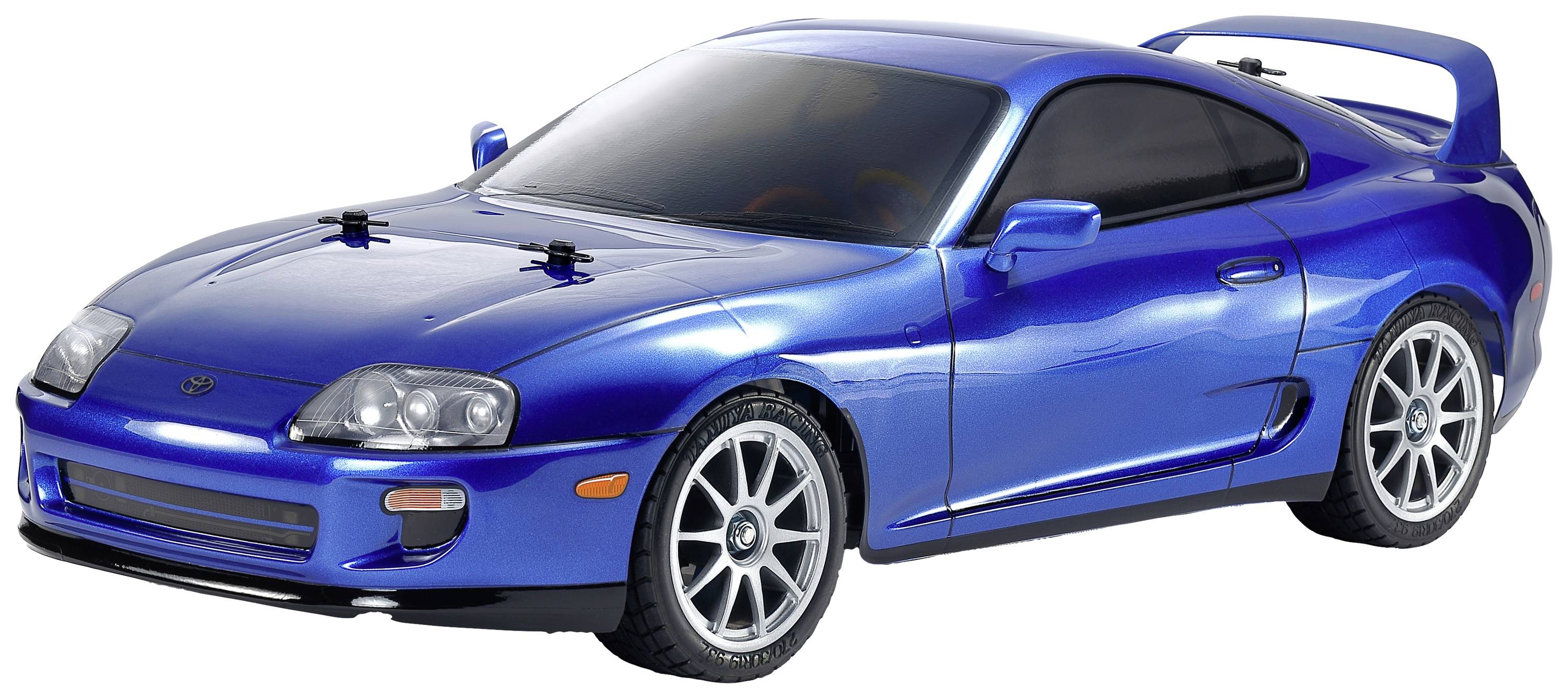 Modèle de voiture de sport bleue, vue de côté. Design aérodynamique distinctif avec de grandes jantes et un aileron arrière.