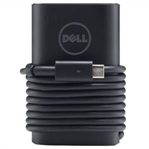 Un chargeur Dell noir pour ordinateur portable avec un câble enroulé.