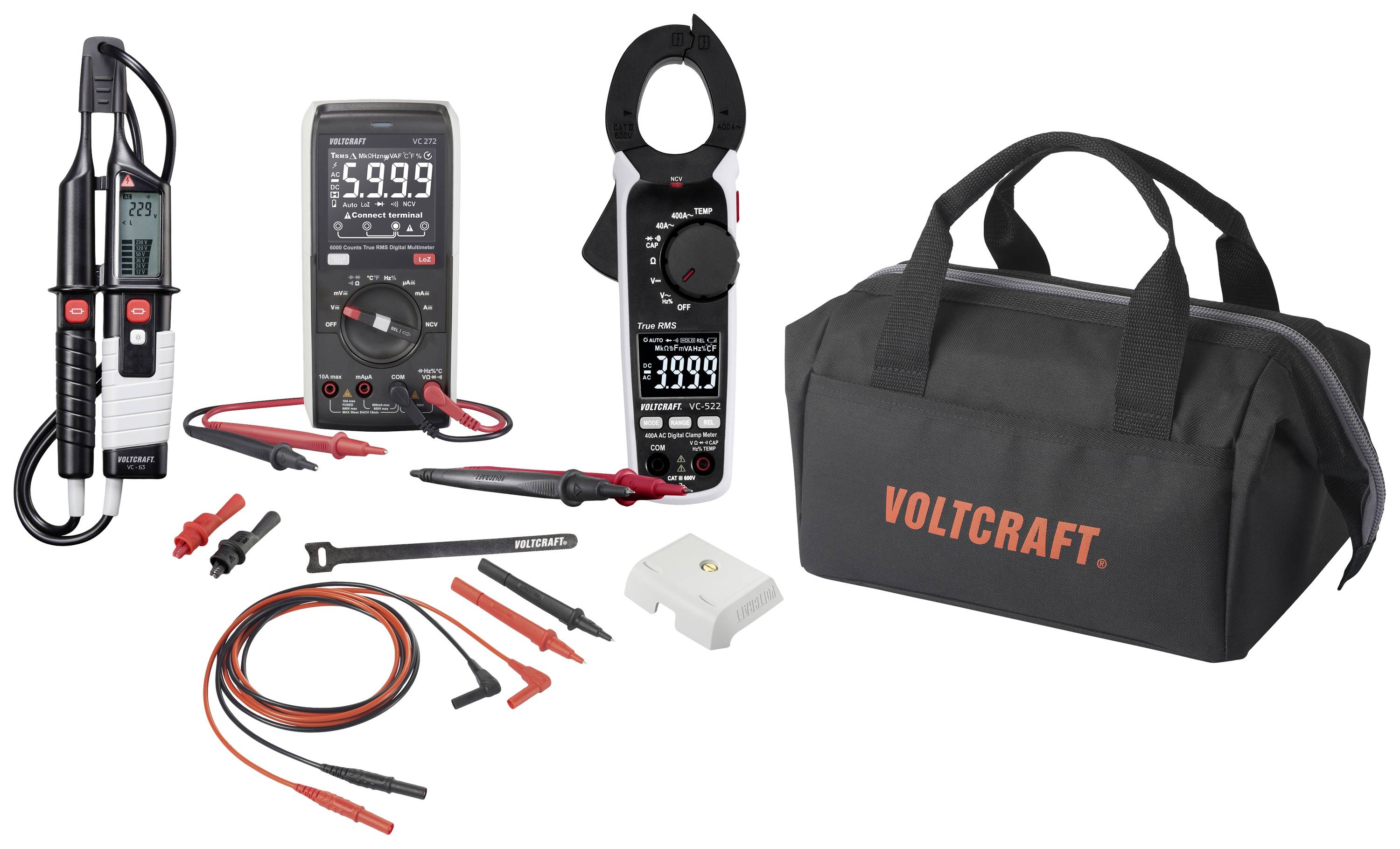 Multimètre, pince ampèremétrique, appareil de mesure et accessoires devant un sac à outils noir avec le logo 'Voltcraft'. Ensembles d'électromesure.