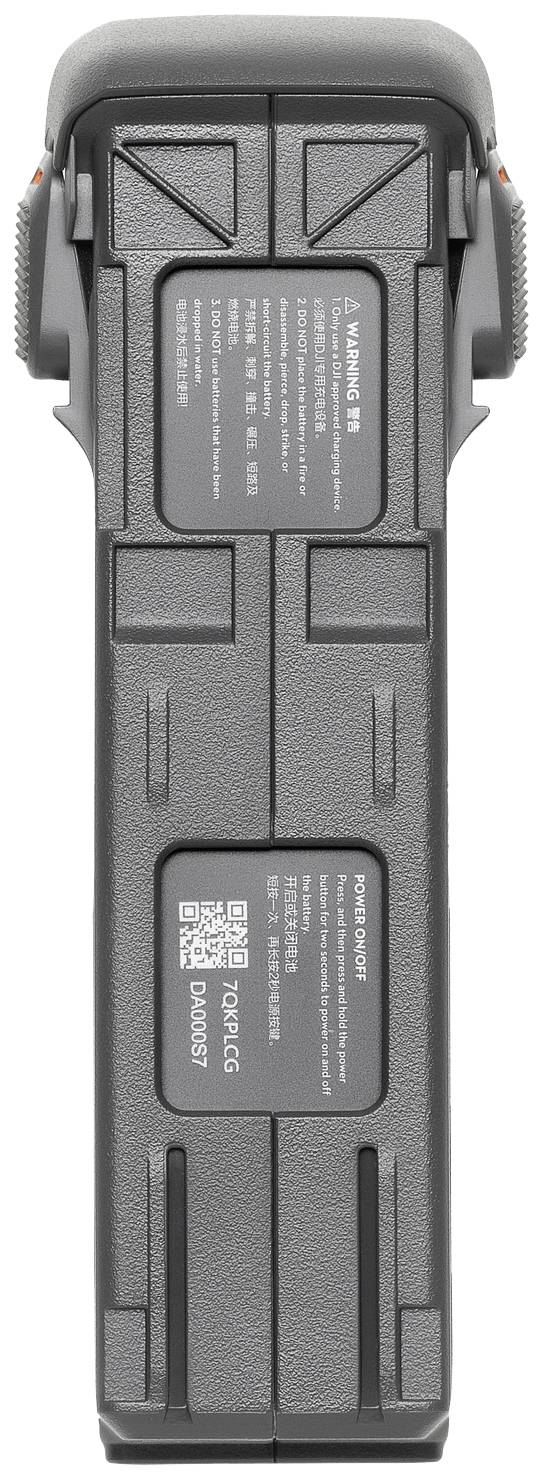 Une batterie de drone grise et rectangulaire avec deux étiquettes d'avertissement et d'identification clairement visibles sur le dessus.