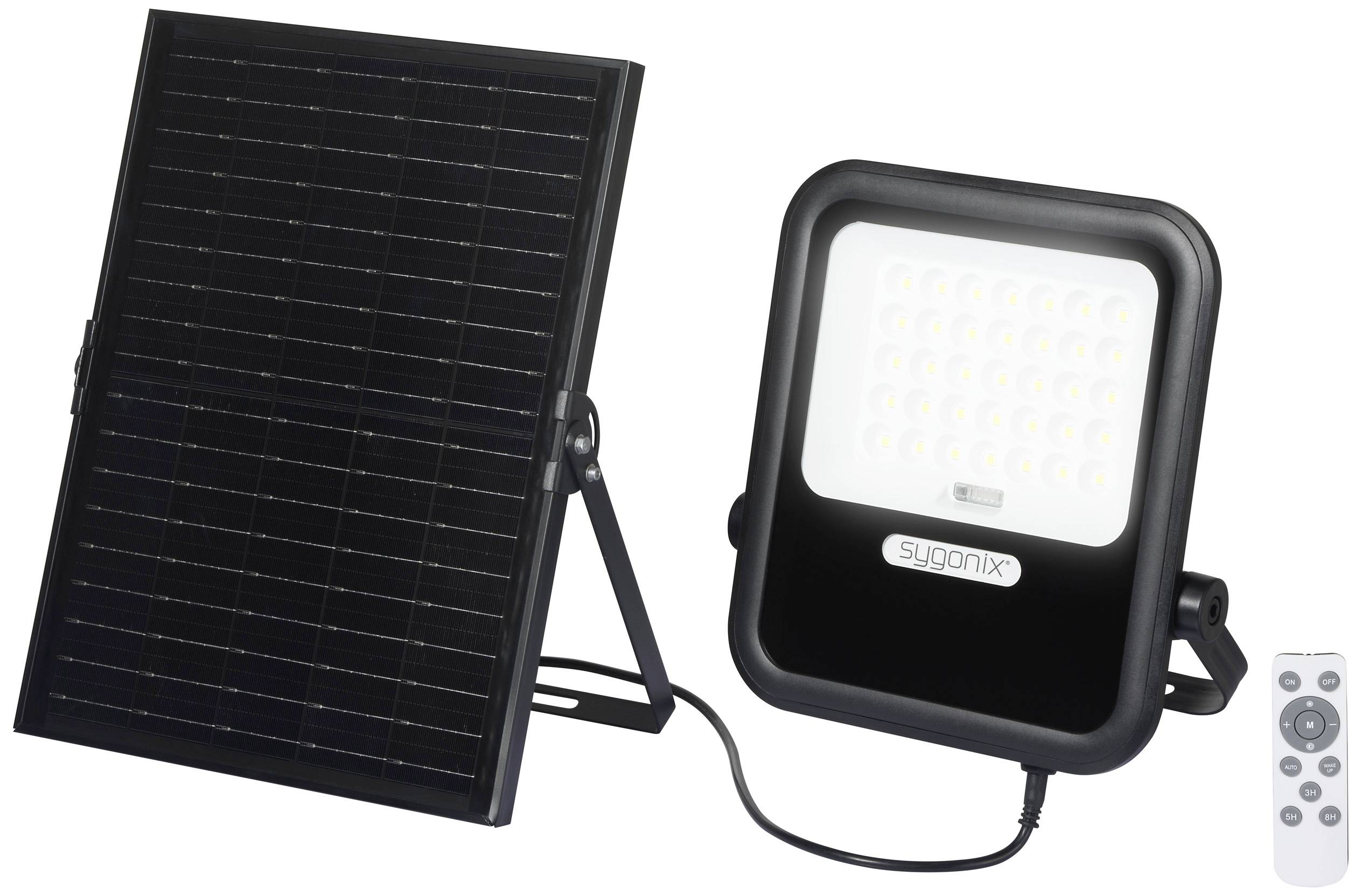 Un panneau solaire connecté à un projecteur LED et une petite télécommande. Adapté pour un éclairage extérieur écologique.