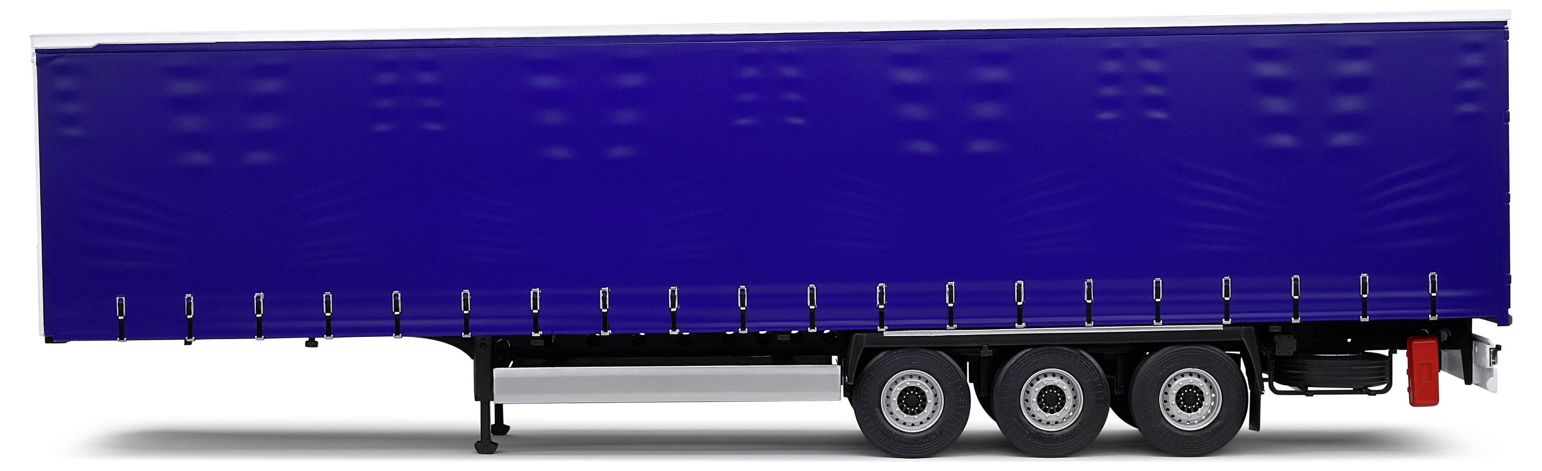 Un remorque de camion bleue à six roues. La remorque est positionnée sur le côté et ne présente aucune information ou inscription supplémentaire.