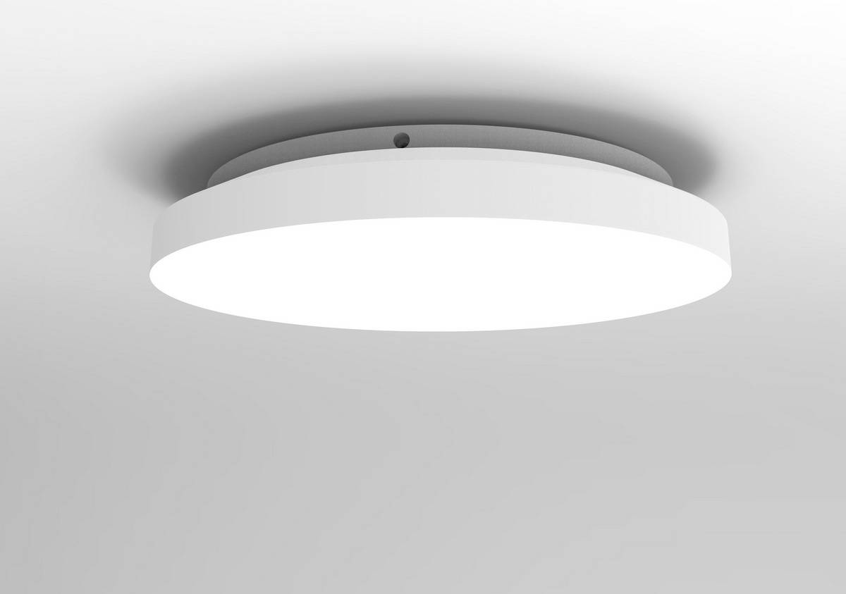 Un luminaire de plafond rond, moderne et blanc, suspendu du haut du plafond et diffusant une lumière vive.