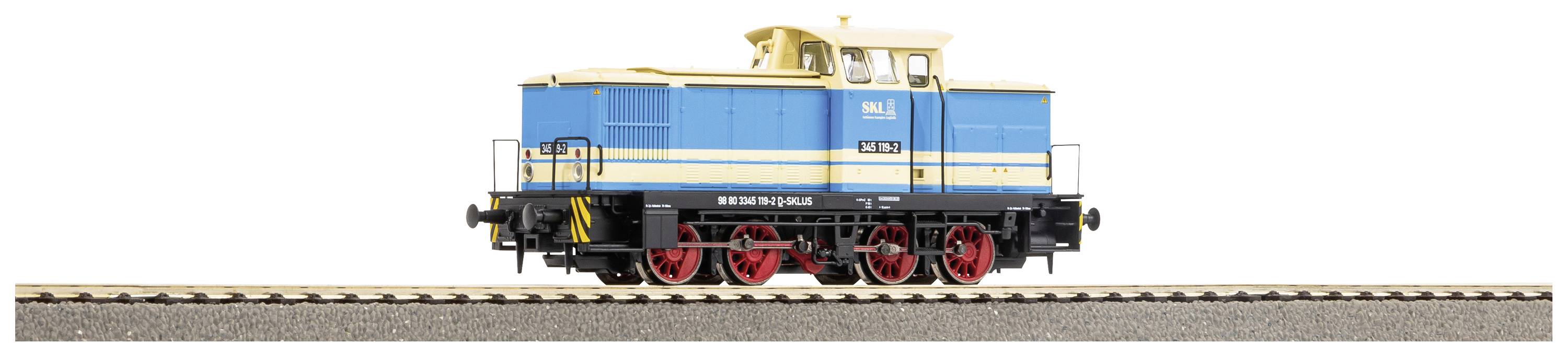Un modèle bleu et jaune d'une locomotive diesel avec un châssis rouge sur une voie ferrée. La locomotive porte le numéro '261'.