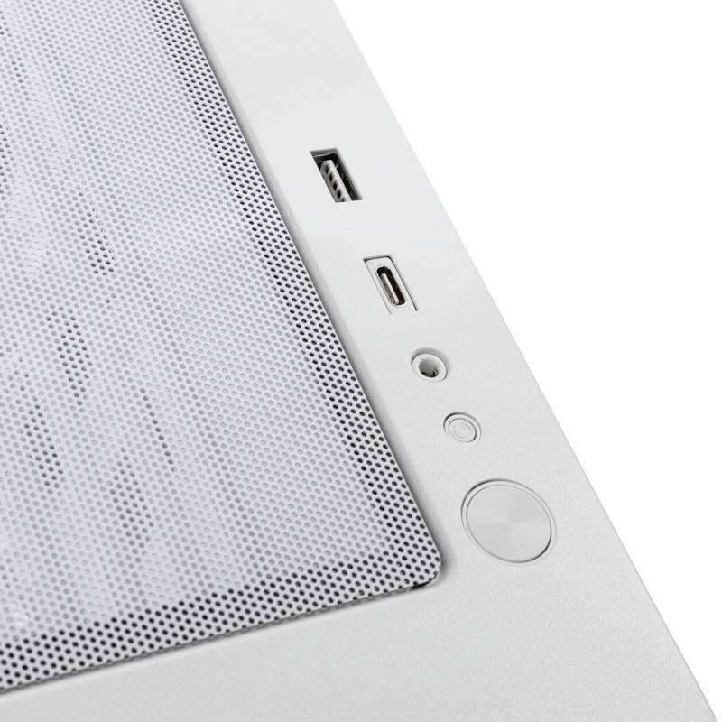 Boîtier d'ordinateur blanc avec perforation, ports USB et bouton d'alimentation, photographié du point de vue d'un oiseau.