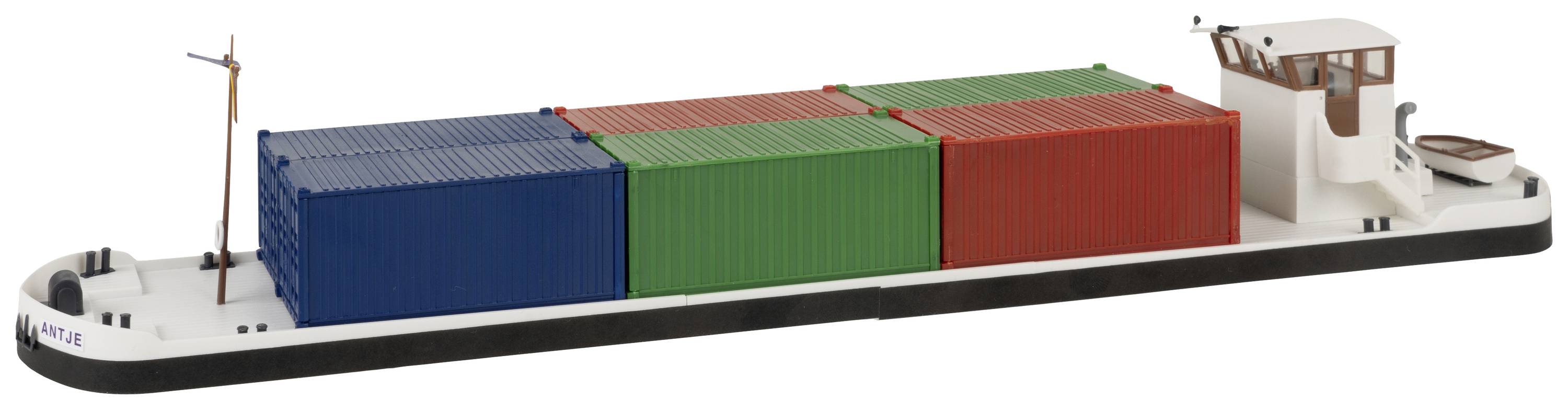 Un cargo transportant six conteneurs colorés sur son pont, disposés en rangées de bleu, rouge et vert, navigue sur une étendue d'eau. L'accent est mis sur le chargement.