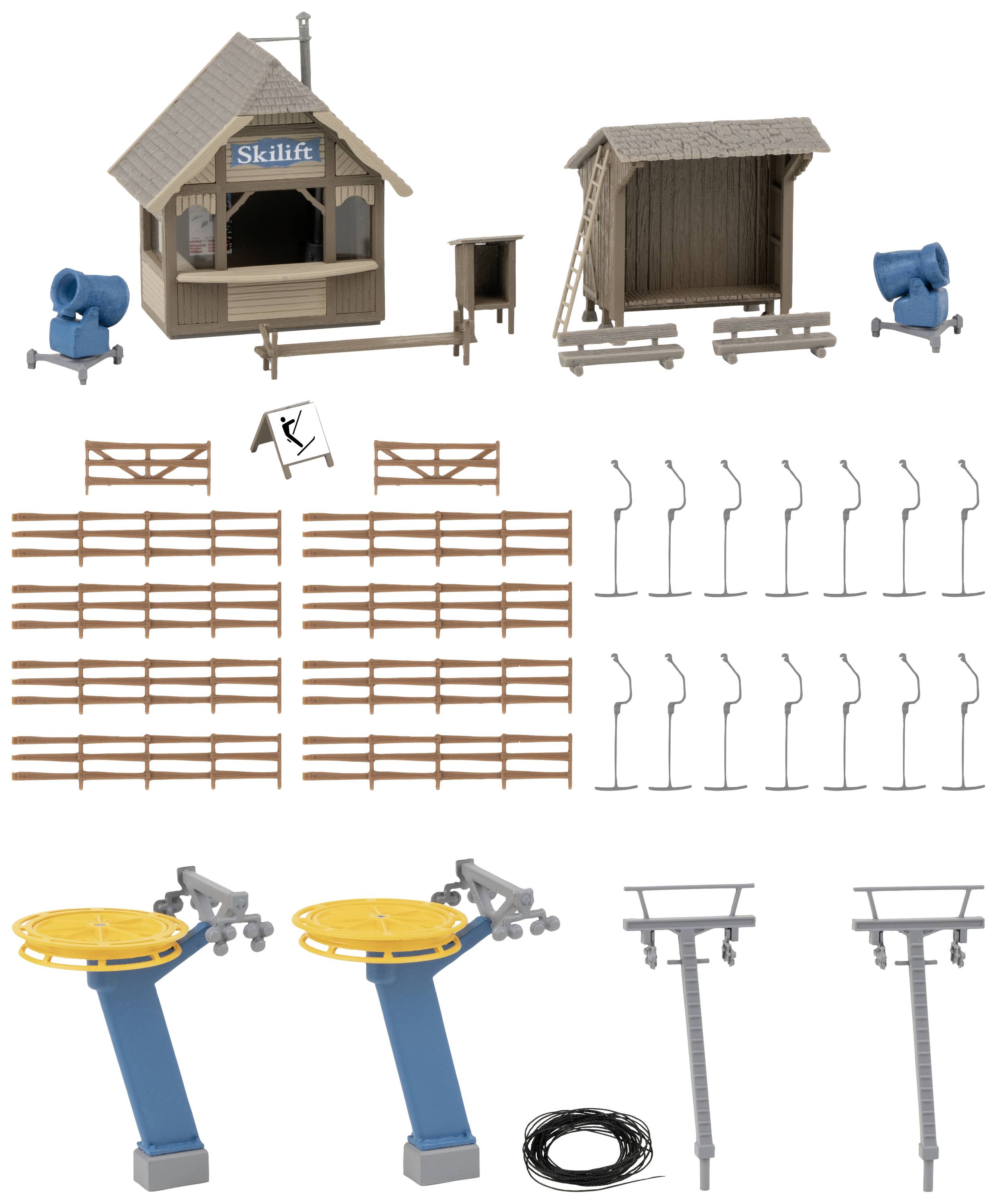 Modèle miniature d'un téléski avec station de remontée mécanique, panneaux, clôtures, canons à neige et accessoires. Adapté pour les réseaux de trains miniatures.