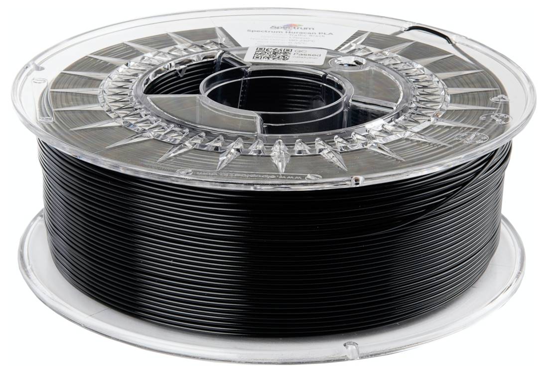 Un rouleau de filament en plastique noir pour imprimante 3D.