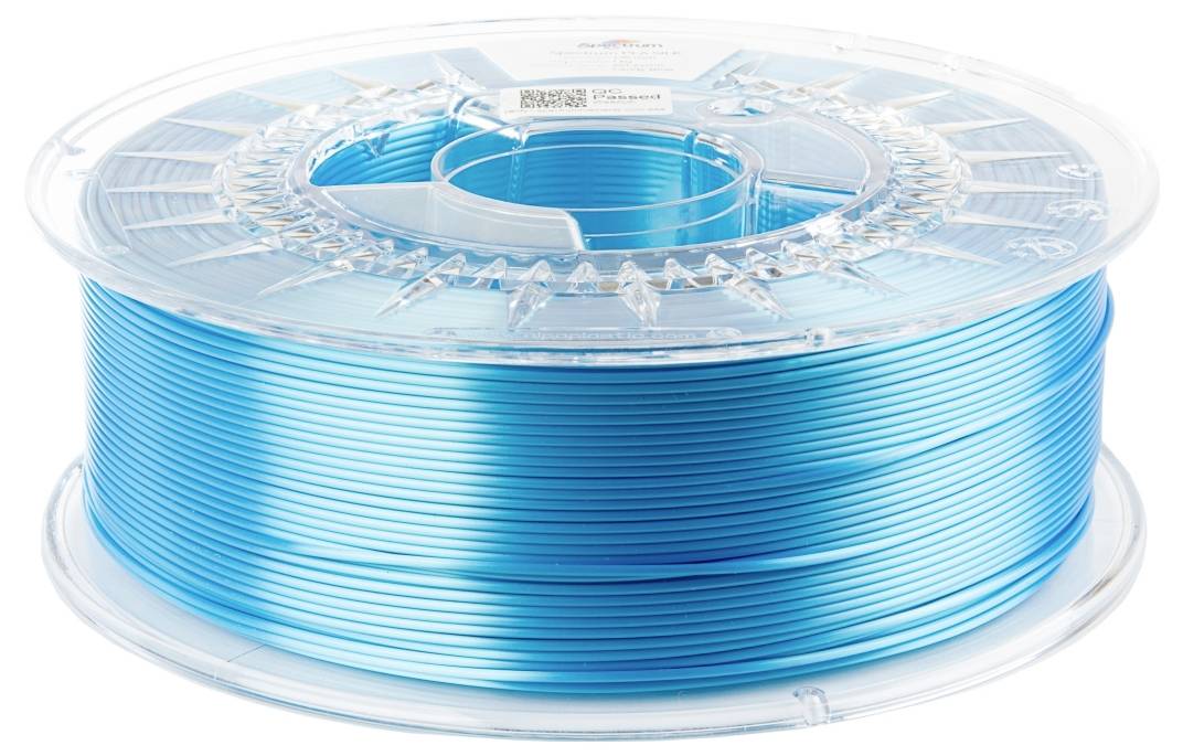 Une bobine de filament d'impression 3D en plastique bleu, clairement emballée et enroulée sur un support en plastique transparent.
