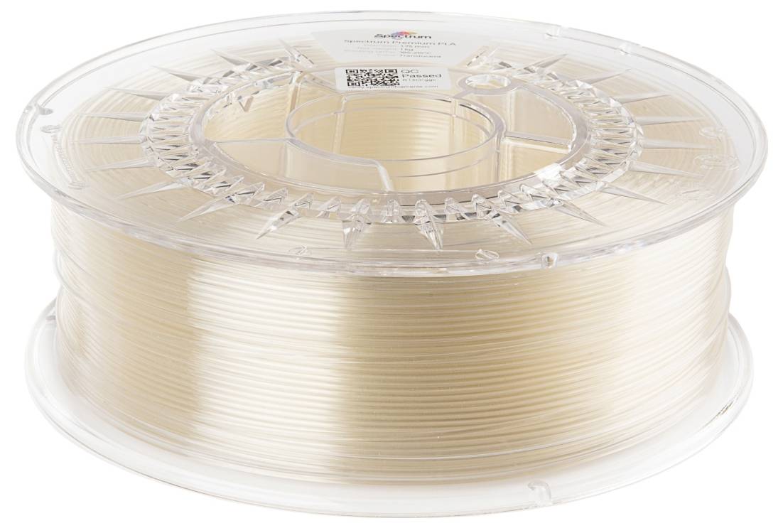 Une bobine transparente avec du filament d'impression 3D beige. La bobine est en plastique et présente une étiquette de code-barres sur le dessus.