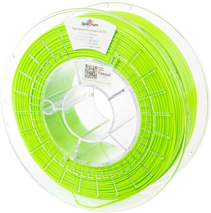 Un rouleau de filament vert vif pour imprimante 3D. L'étiquette indique les informations sur le matériau et les spécifications de température.