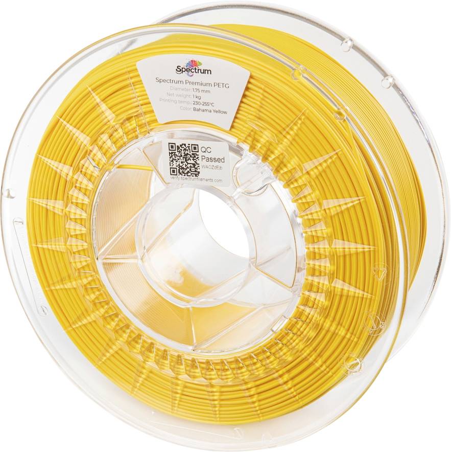 Bobine de filament jaune pour imprimante 3D. L'étiquette indique : 'Spectrum Premium PETG', température d'impression 230-250°C. Boîtier transparent.
