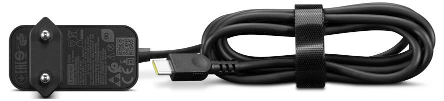 Adaptateur secteur noir avec câble et port USB, maintenu par une attache velcro, posé sur un fond blanc.