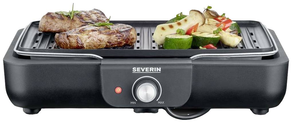 Deux steaks et des légumes sur un grill de table électrique ; les steaks semblent juteux, les légumes sont grillés et colorés.