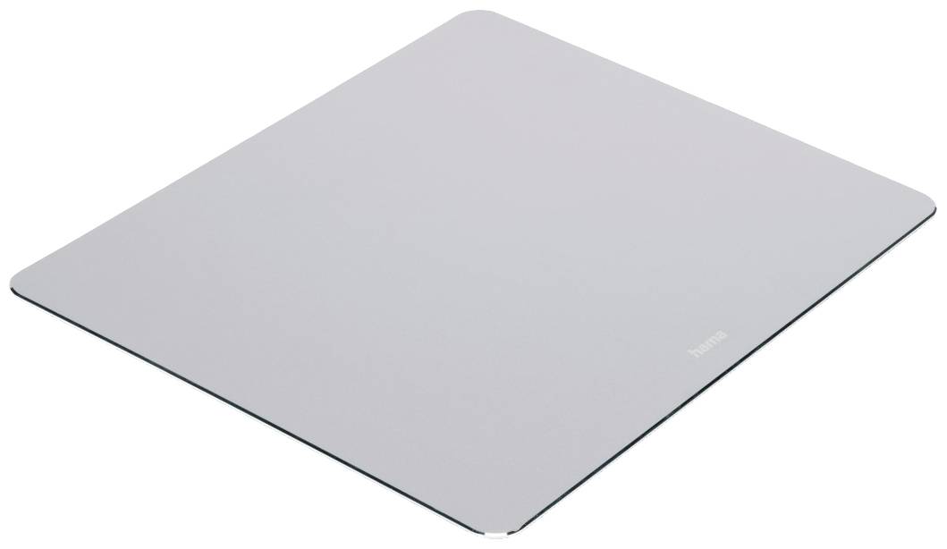 Une plaque de verre rectangulaire grise aux coins arrondis est posée à plat. Elle reflète légèrement la lumière et présente une surface lisse.