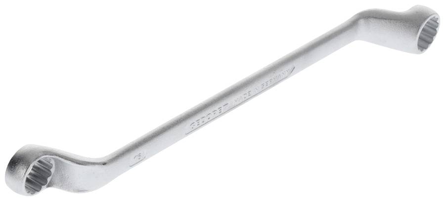 Une clé mixte en argent avec deux tailles différentes d'hexagones à chaque extrémité, utilisée pour serrer des écrous et des têtes de vis.