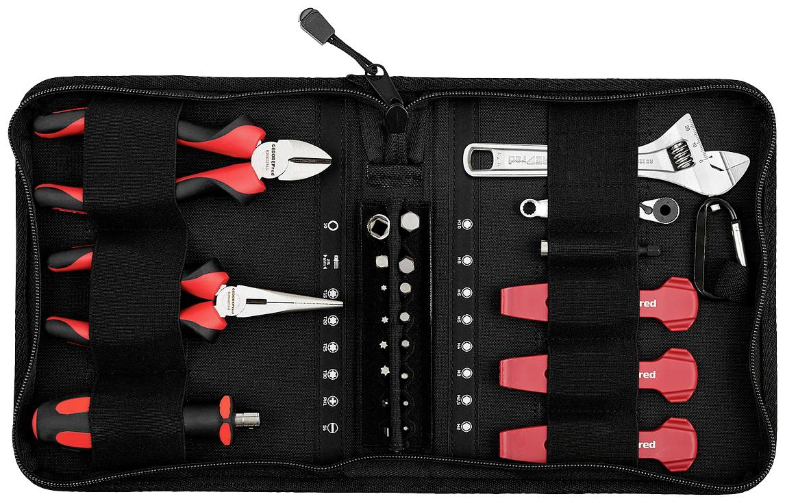 Un ensemble d'outils ouvert comprenant des pinces, des clés, des tournevis et des embouts dans une pochette en tissu noir.