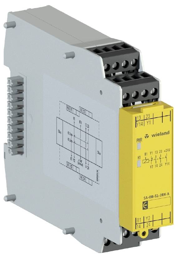 Un relais de sécurité jaune de Wieland dans un boîtier gris, utilisé pour le contrôle des fonctions de sécurité dans les installations électriques.