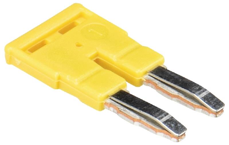 Un pont de jonction en plastique jaune avec deux broches de contact, utilisé pour connecter des circuits électriques sur des circuits imprimés.