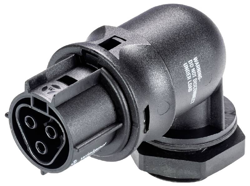 Adaptateur noir et gris avec plusieurs ouvertures de connexion rondes, avec des avertissements sur la surface latérale.