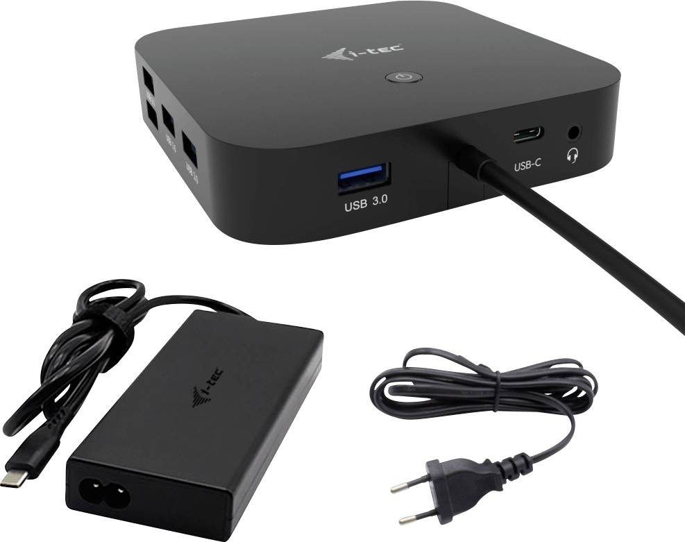 Un dock USB-C noir avec plusieurs ports, comprenant des ports USB 3.0 et USB-C, à côté d'un adaptateur secteur et d'un câble d'alimentation.