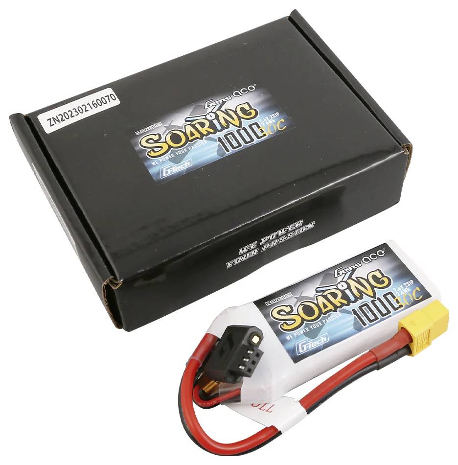 Une boîte noire portant l'inscription « SOARING 100C » avec sa batterie correspondante. La batterie dispose de câbles rouges et noirs munis d'une fiche jaune.