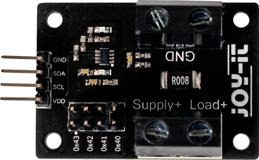 Module électronique avec bornes, étiquetage : GND, Supply+, Load+, VDD. Circuit imprimé montrant de petits composants électroniques.
