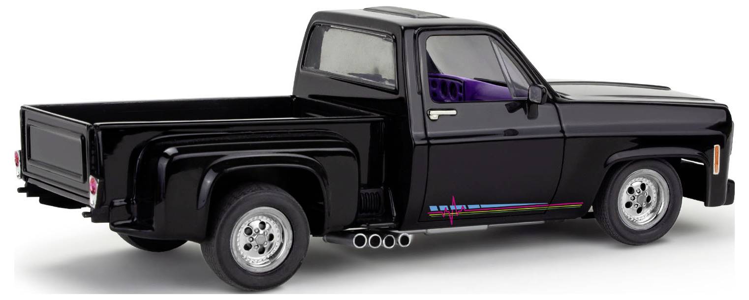 Camion pickup noir de profil avec une bande colorée sur le côté, sur un fond clair. Modèle d'un camion classique.