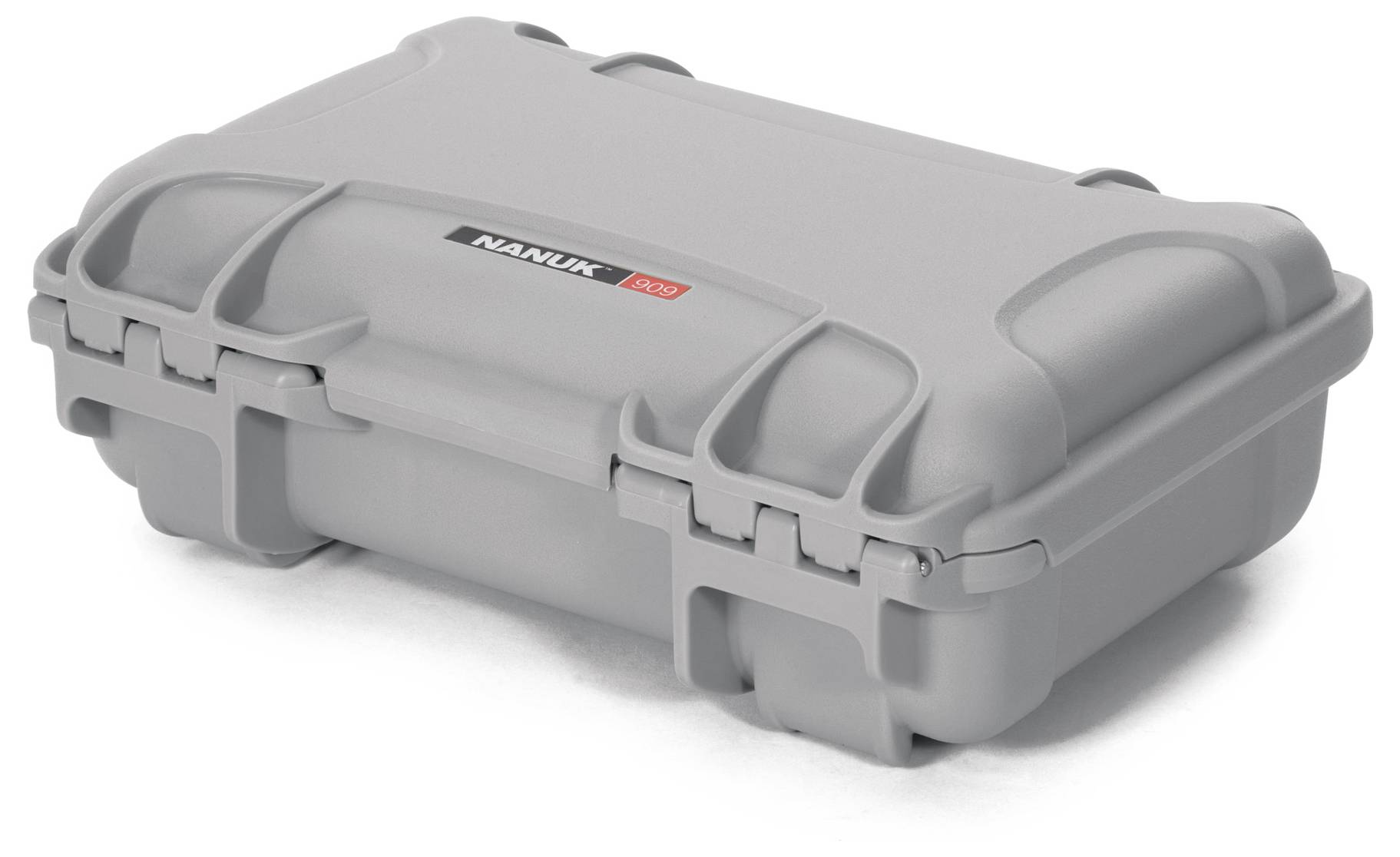 Valise rigide grise, robuste, avec des coins arrondis et des fermetures, adaptée au transport et à la protection sécurisés des objets.