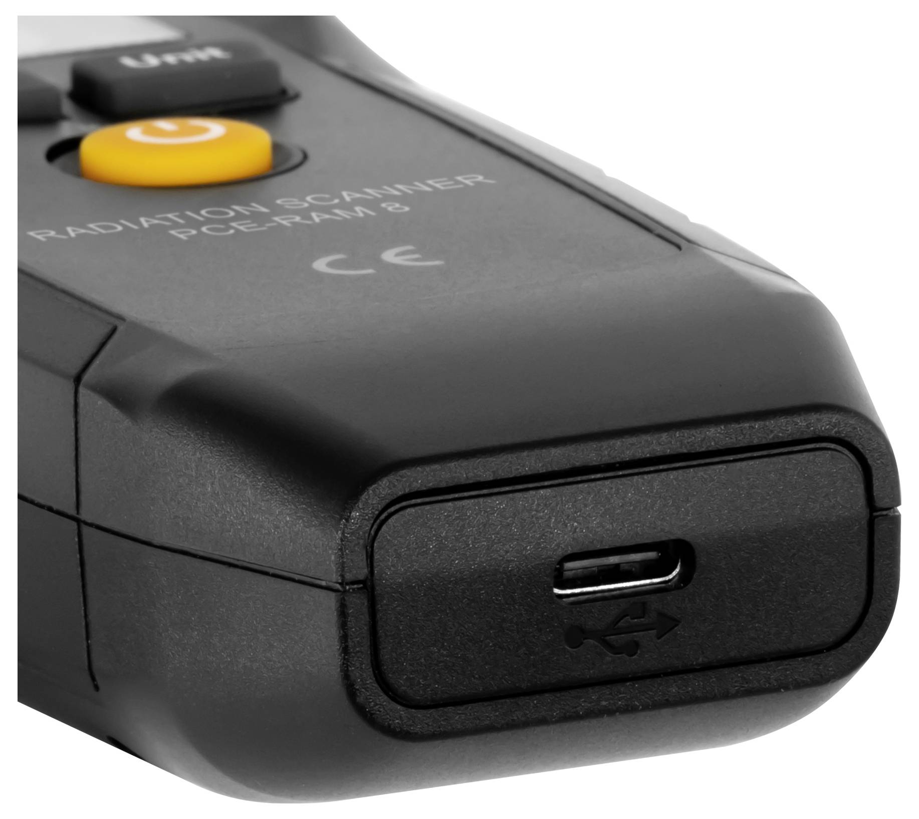 Gros plan d'un appareil de balayage de rayonnement noir avec un bouton d'alimentation et un port de charge USB-C.