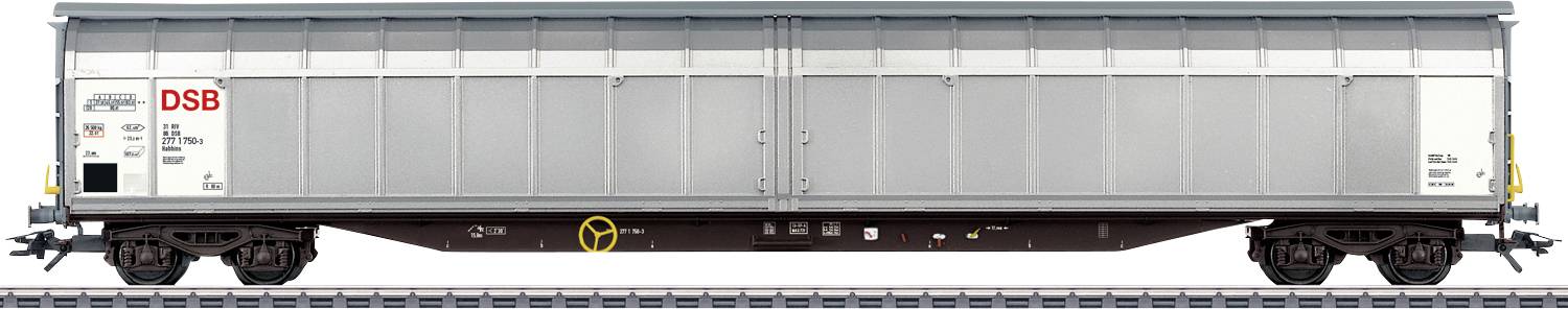 Wagon de marchandises des DSB sur une voie ferrée, couleur extérieure grise, portes coulissantes fermées, design robuste pour le transport de marchandises.