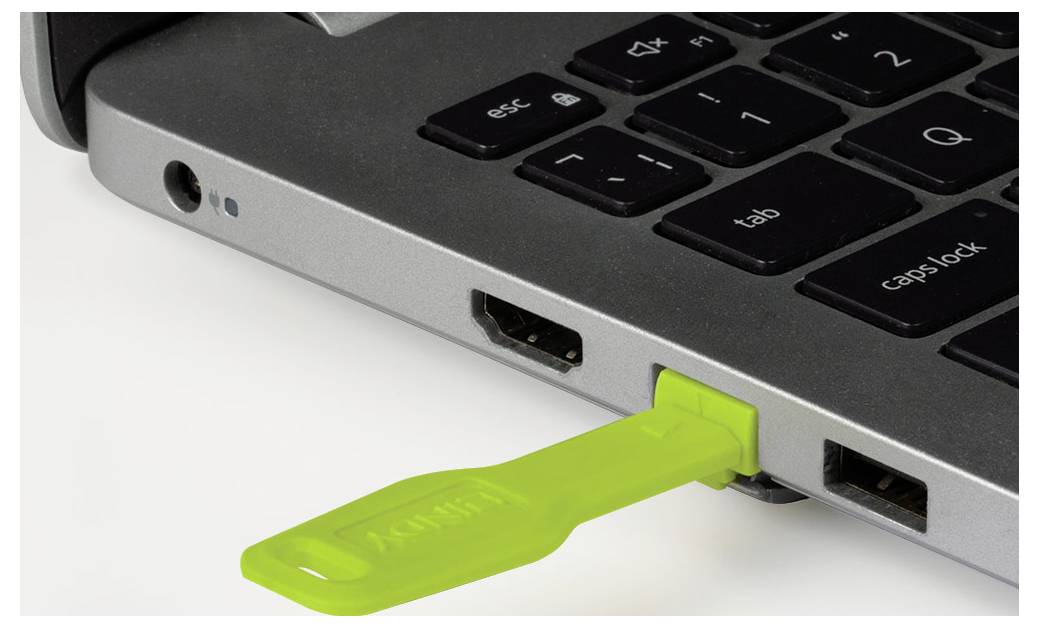 Vue arrière d'un moniteur de bureau tout-en-un argenté avec un support central et des ports USB et d'alimentation visibles à l'arrière.